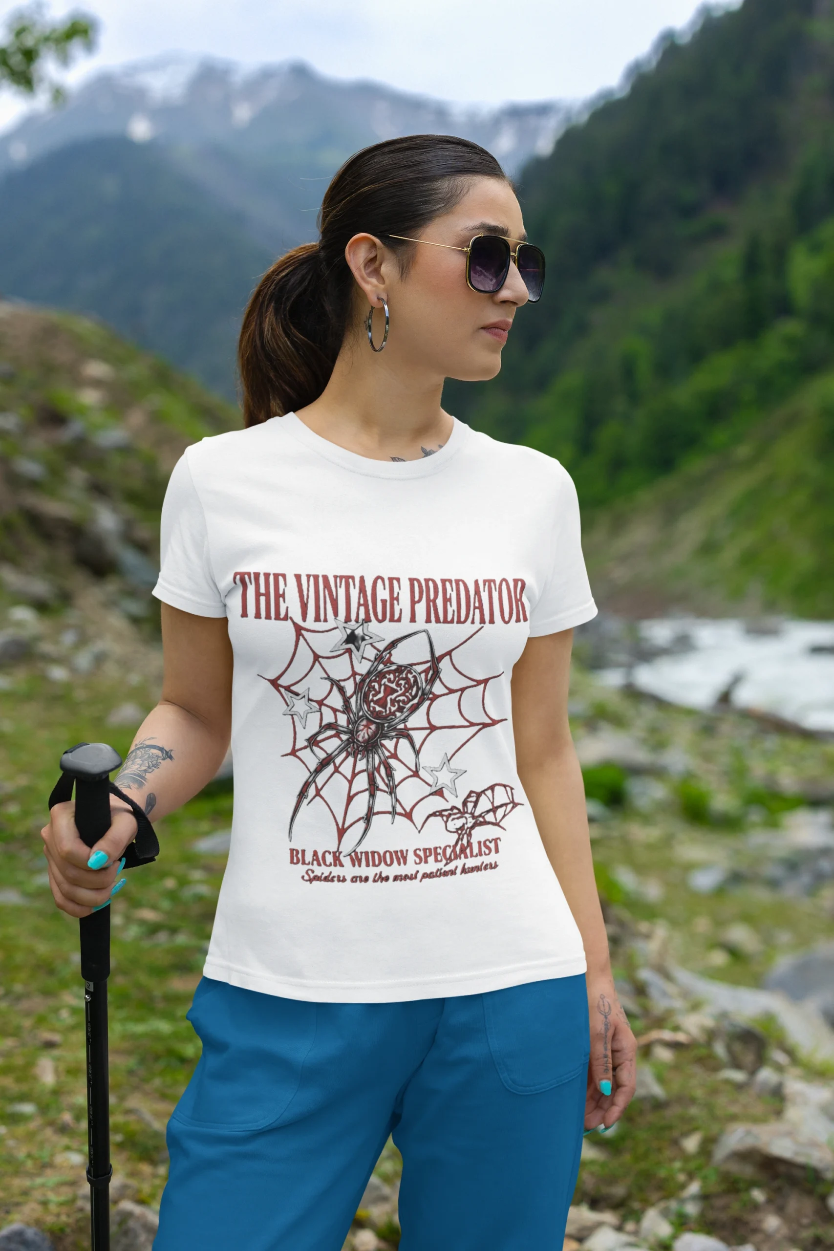 gildan-t-shirt-mockup-featuring-a-woman-on-a-mountain-with-a-hiking-stick-m35570 (1) The Vintage Predator – Black Widow Regular T-Shirt | Round Neck - Image 1