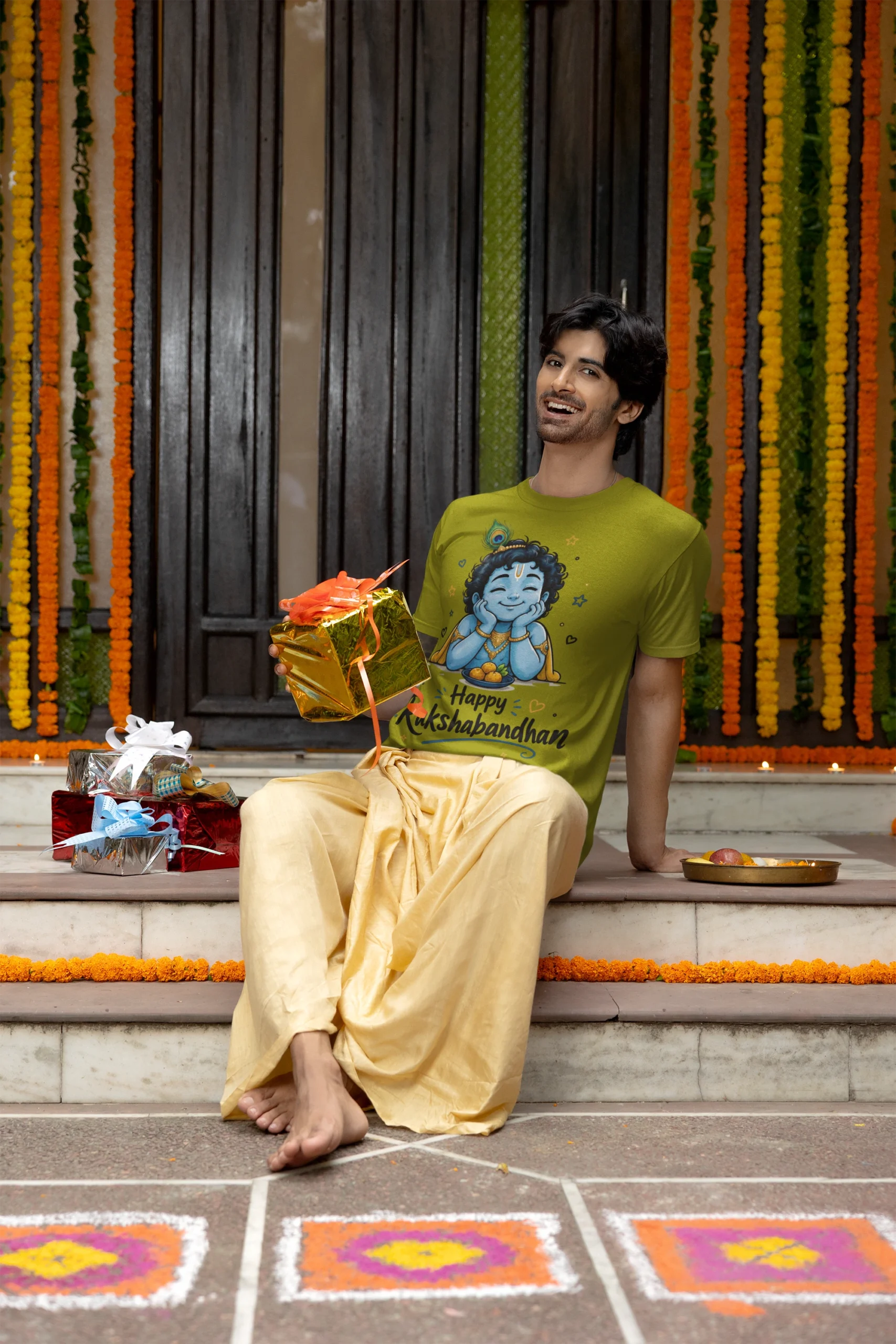 gildan-t-shirt-mockup-featuring-a-cheerful-man-holding-a-gift-for-diwali-m36008 (5) Happy Raksha Bandhan Krishna Graphic T-Shirt – Regular Fit - Image 1
